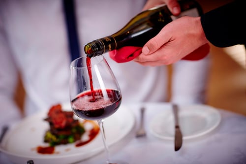 Culinary Arts - Pouring a Glass of Red Wine at a Restaurant