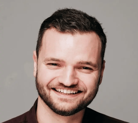 Partners Alumni - Torin Mitchell Smiling at the Camera